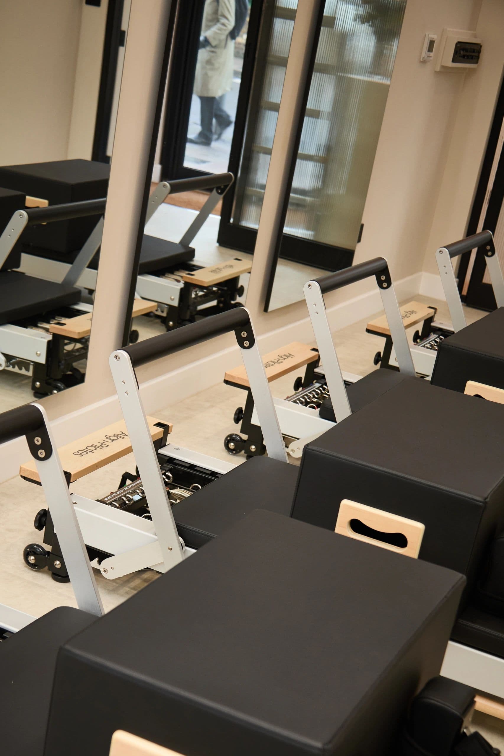 The reformer row, with the shopfront door reflected in the mirror